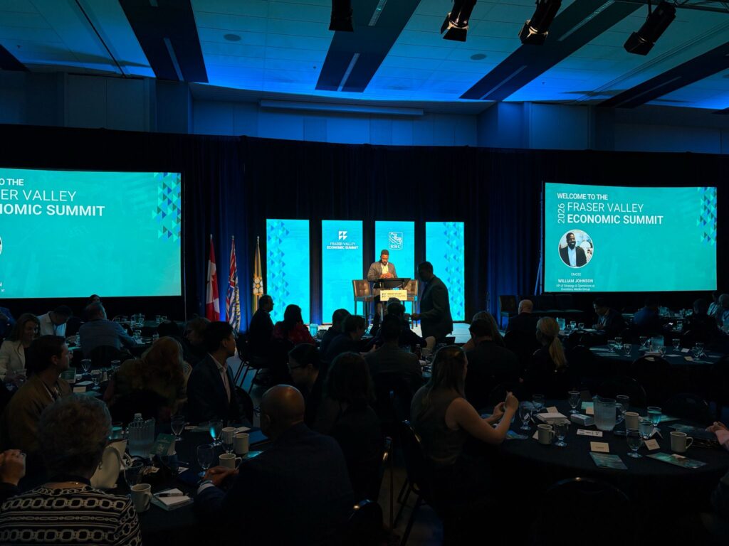 Event room with stage lighting and presentation screens