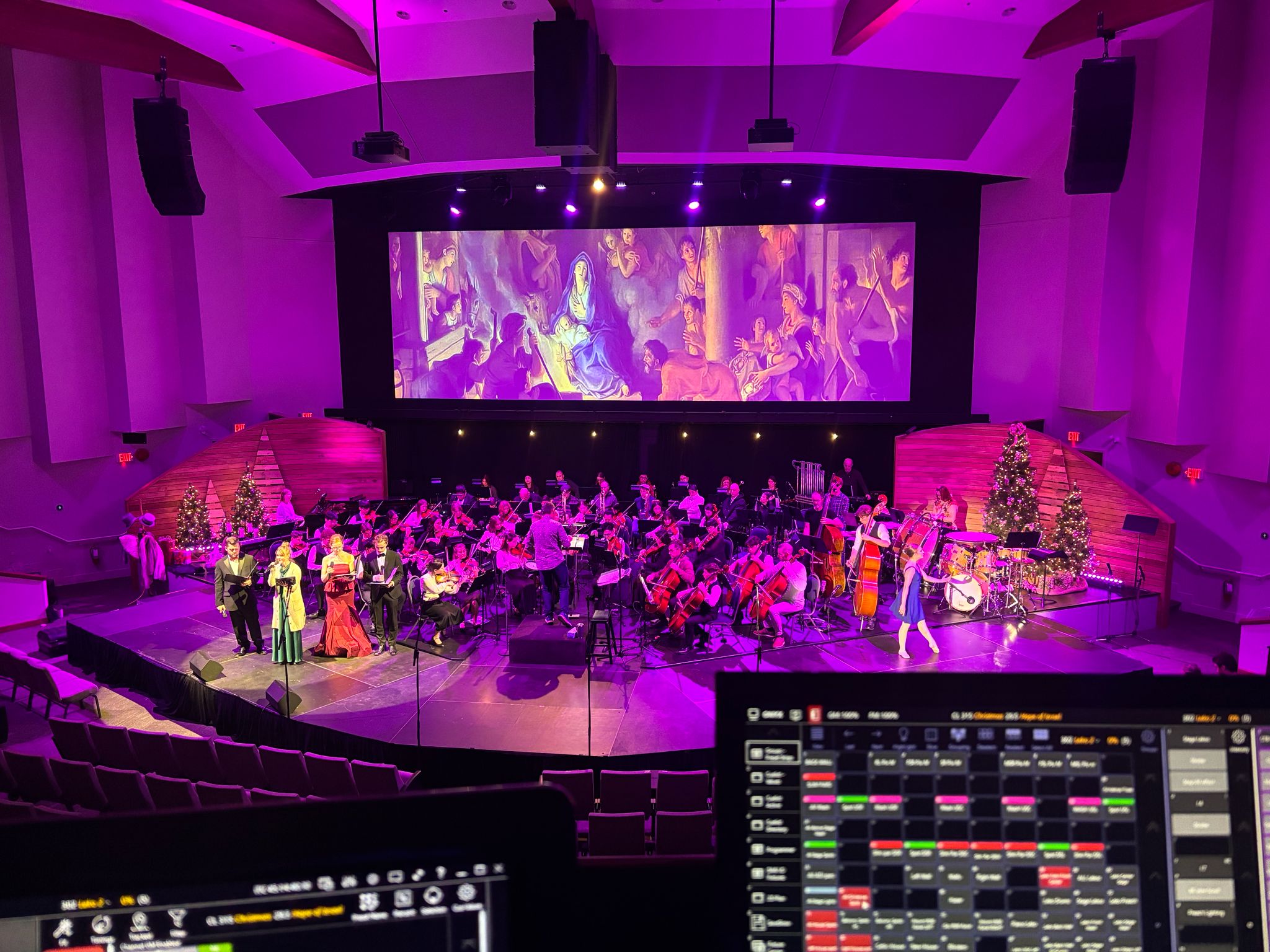 Live stage performance with musicians and a projection screen